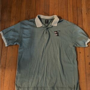 Warner Bros. Light Teal Polo with White Trim and Golfer Embroidery